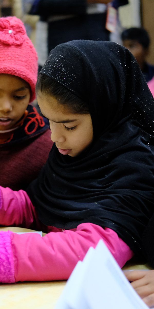 Aisha working on a project at a workshop